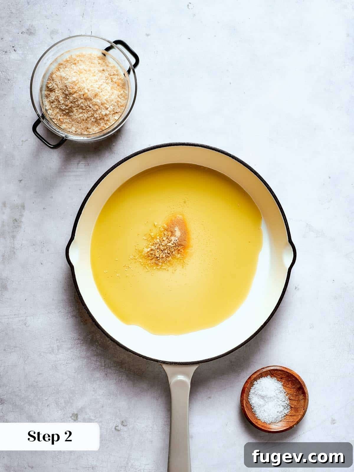 Vibrant Tuscan Kale Delight 9 Oil and seasonings heating in a pan as the first step in Tuscan kale salad topping preparation.
