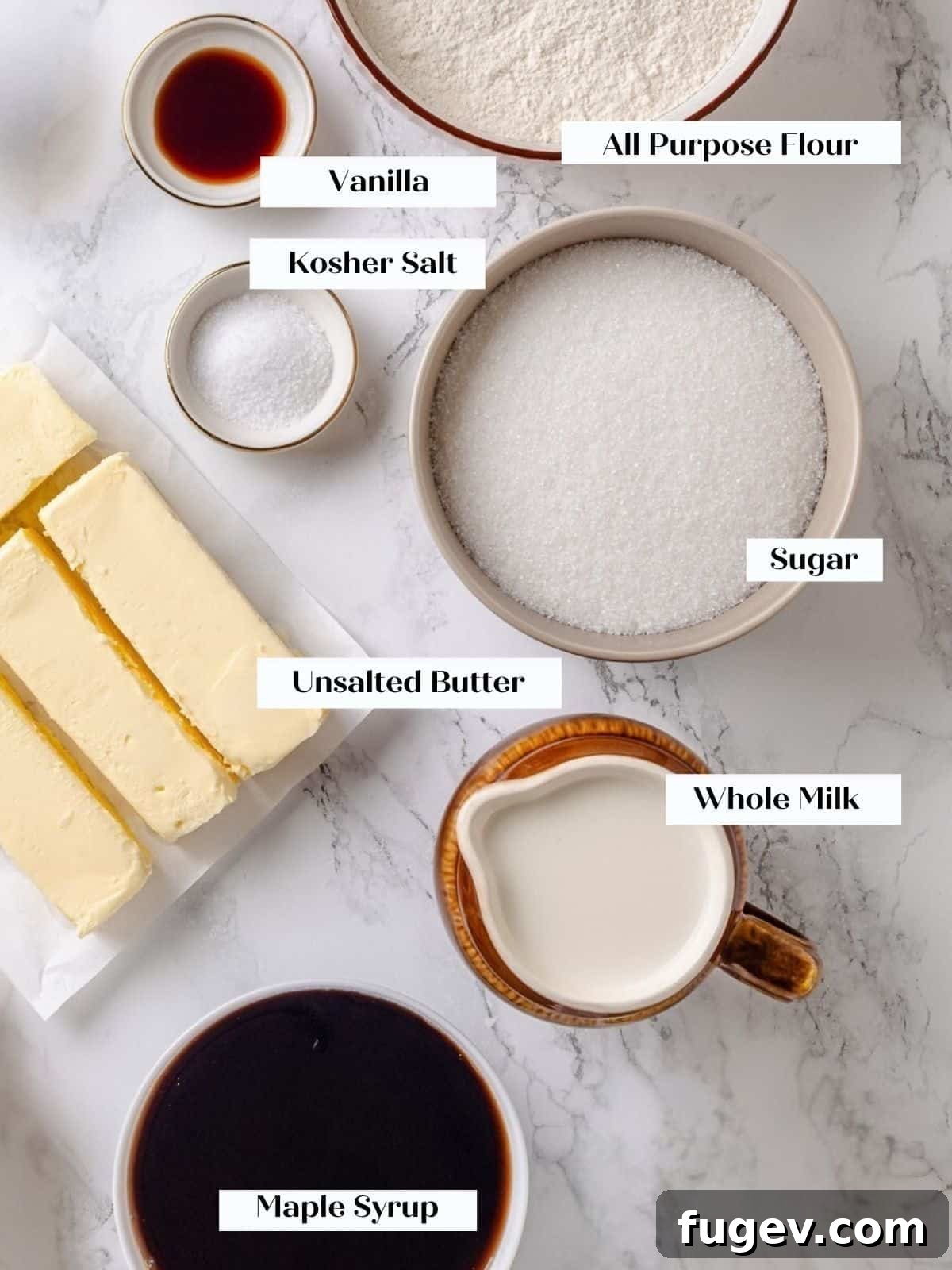 Golden Maple Delight 3 Ingredients for maple frosting, including flour, sugar, milk, and pure maple syrup, neatly arranged on a kitchen countertop.