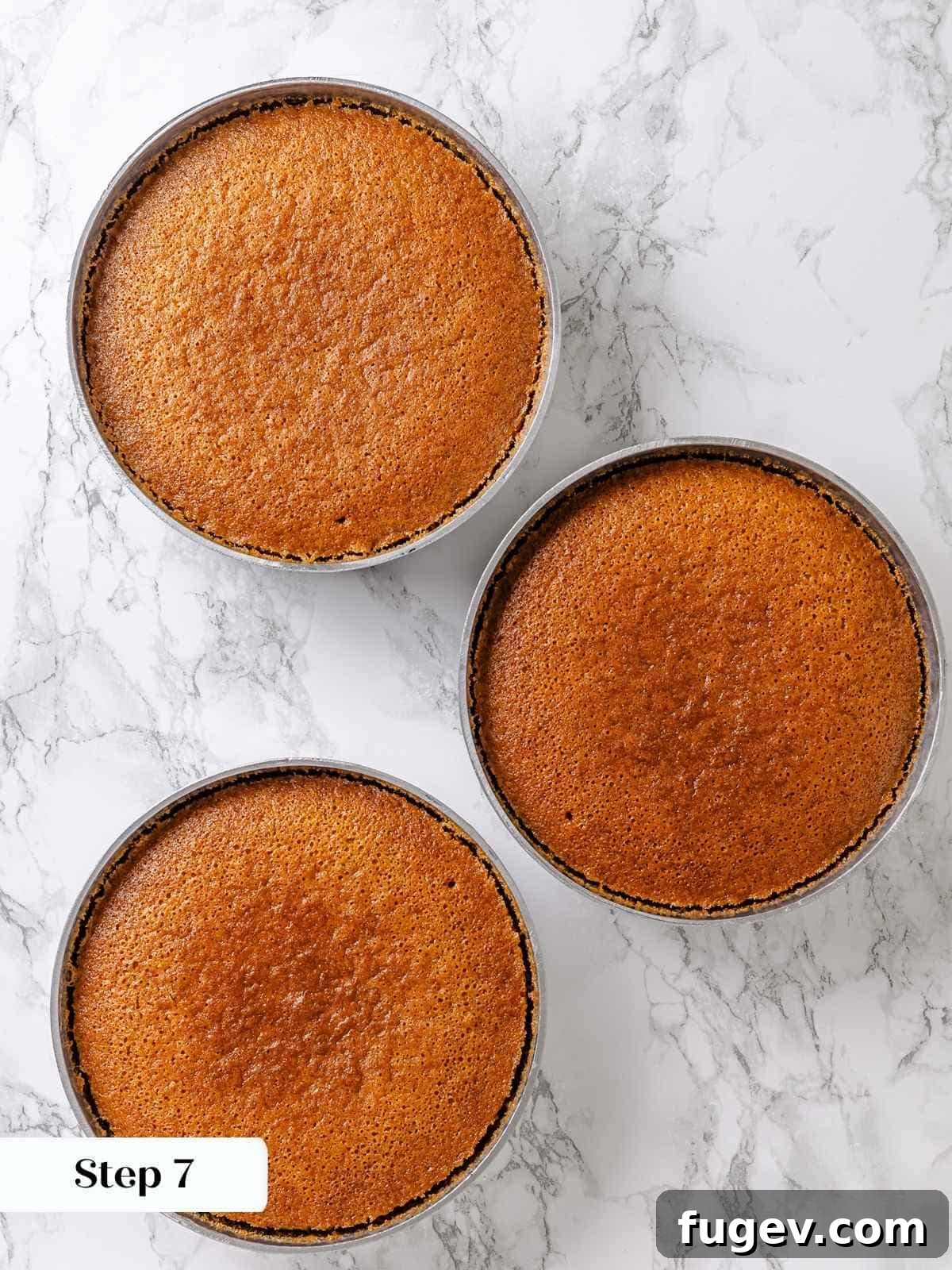 Golden Maple Temptation 11 Golden brown baked maple cake layers cooling in their round pans after baking.