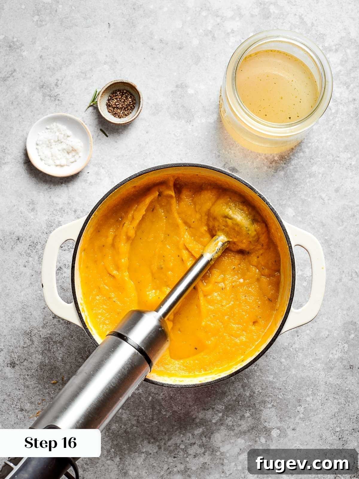 Golden Harvest Squash Soup 12 Immersion blender pureeing squash soup until creamy and smooth in the pot.