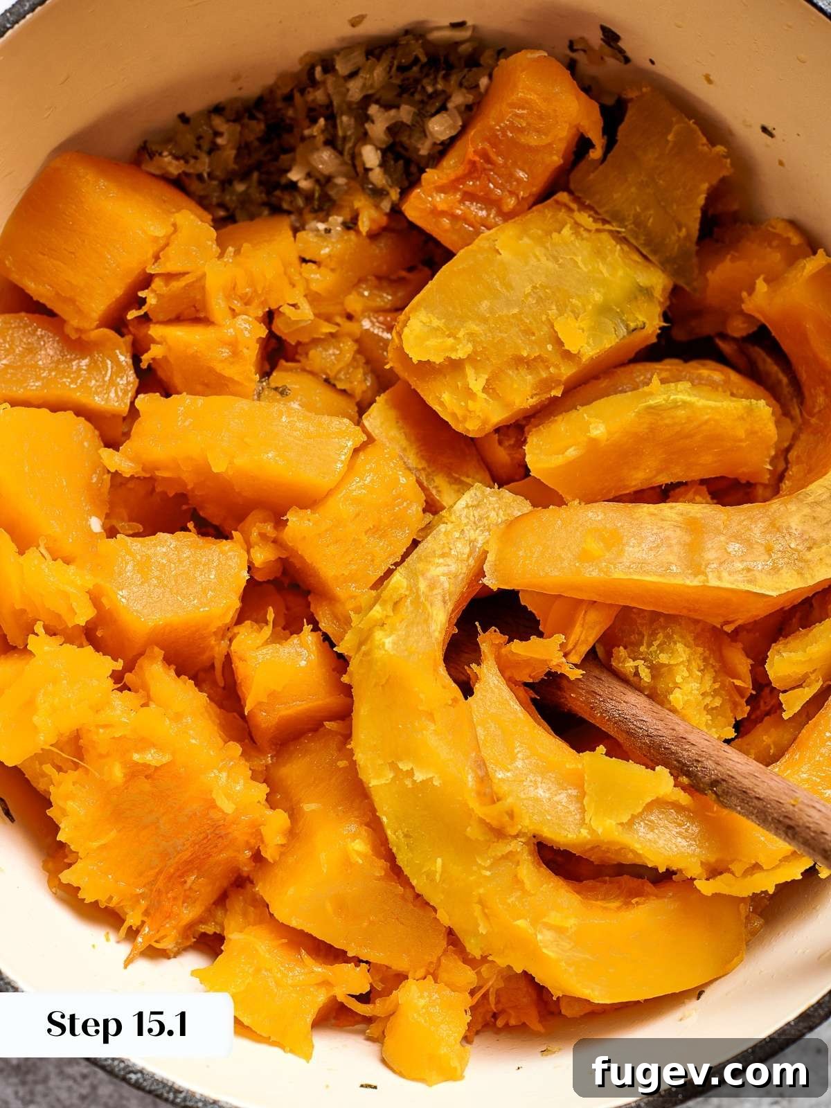 Golden Harvest Squash Soup 10 Cubes of squash simmering in broth, breaking down as they soften into soup.