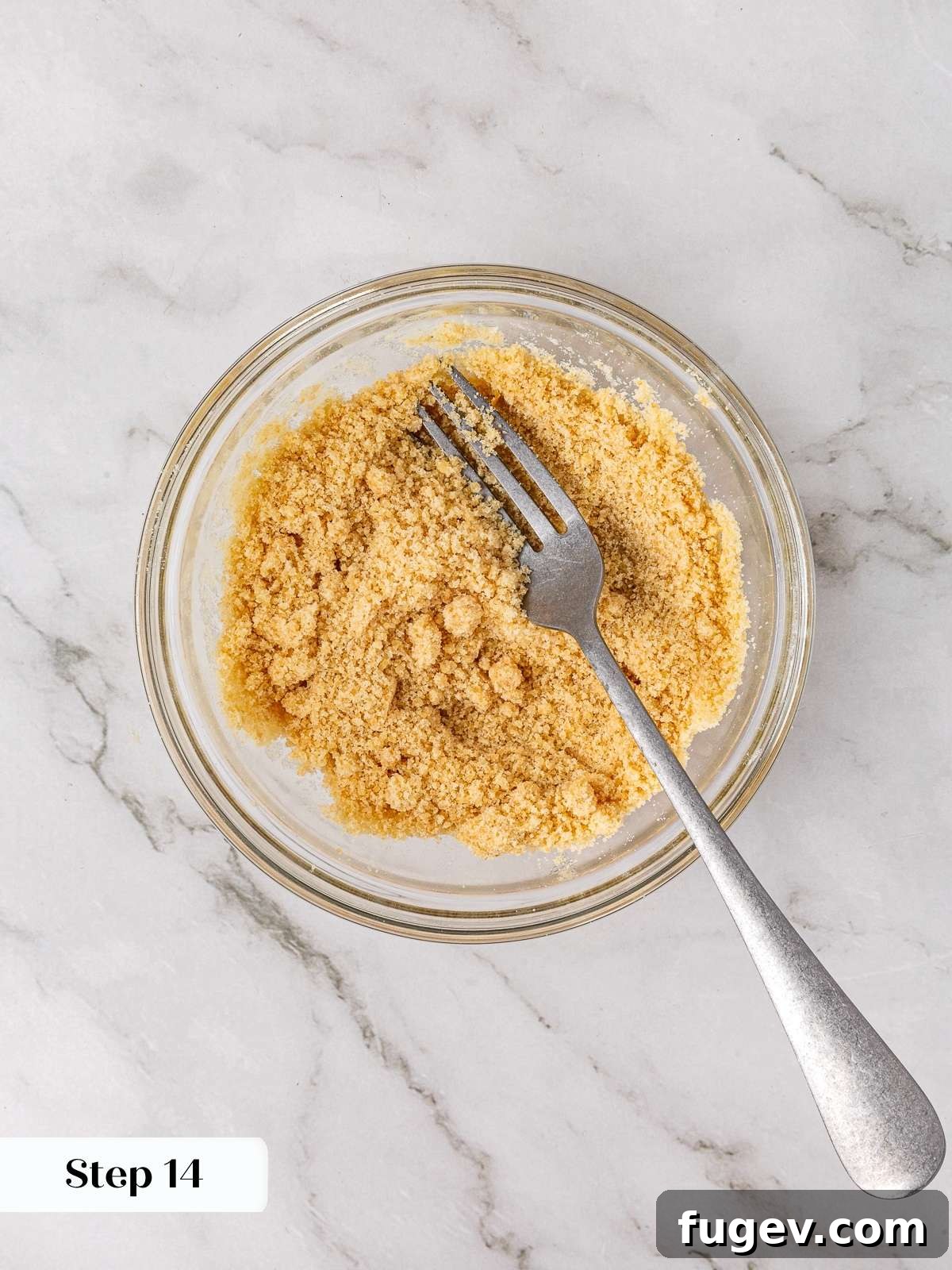 Warm Apple Spice Cookies 12 Brown sugar crumble mixture forming in a clear bowl after being stirred with melted butter and vanilla extract, demonstrating the ideal crumbly yet cohesive texture.