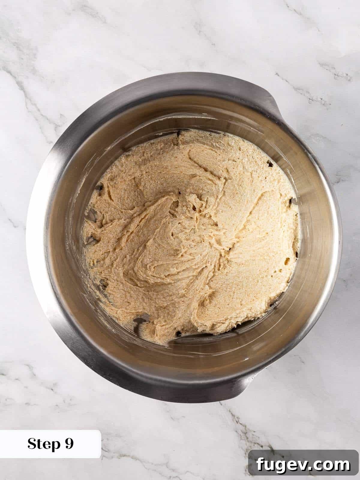 Warm Apple Spice Cookies 8 Softened unsalted butter and two types of sugars (granulated and light brown) being creamed together until light and fluffy, forming the luxurious base for the chewy cookie dough.