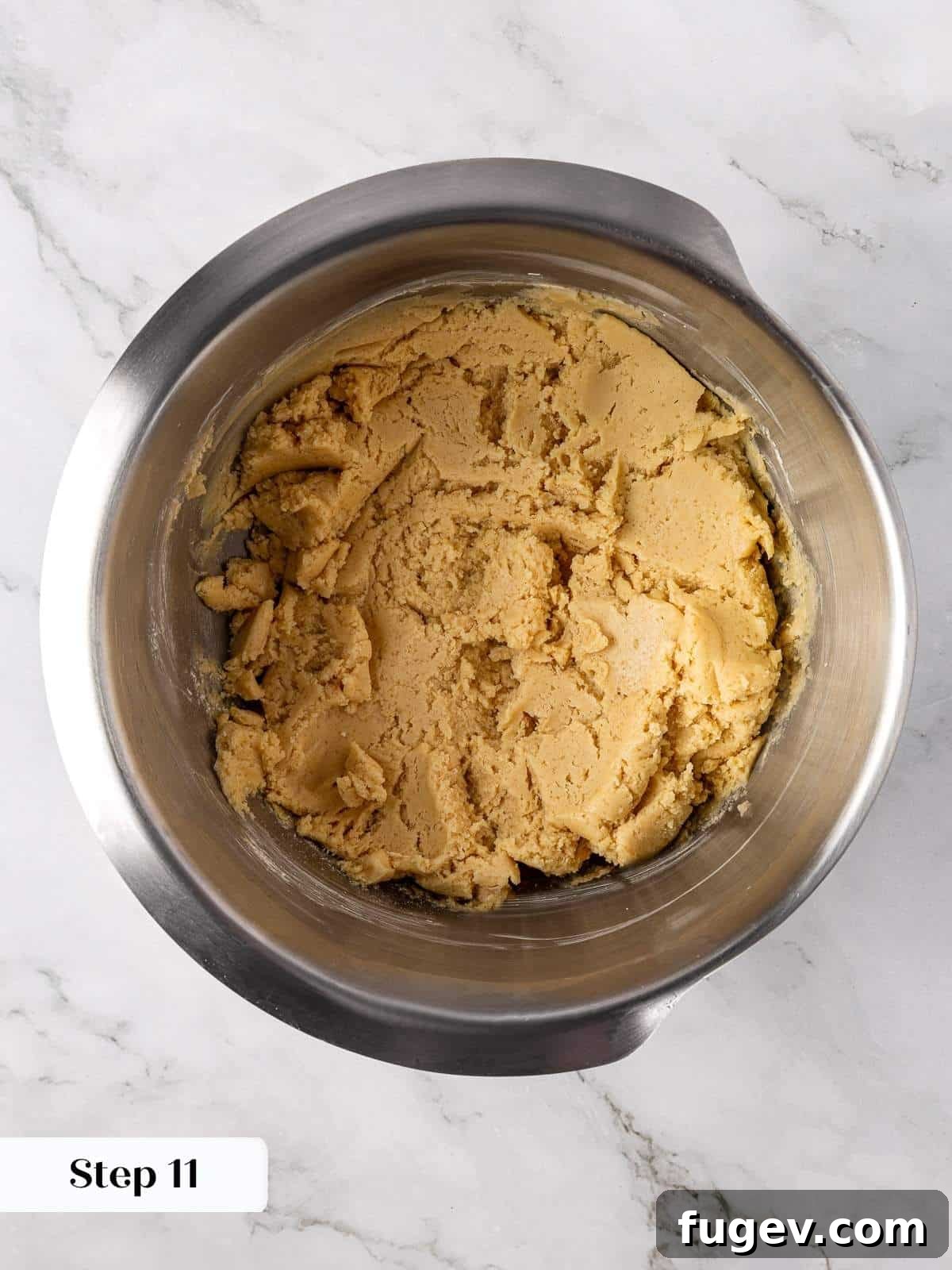 Warm Apple Spice Cookies 10 The finished apple cookie dough, thick and pale, resting cohesively in a large mixing bowl, visually ready for scooping and forming into individual cookies.