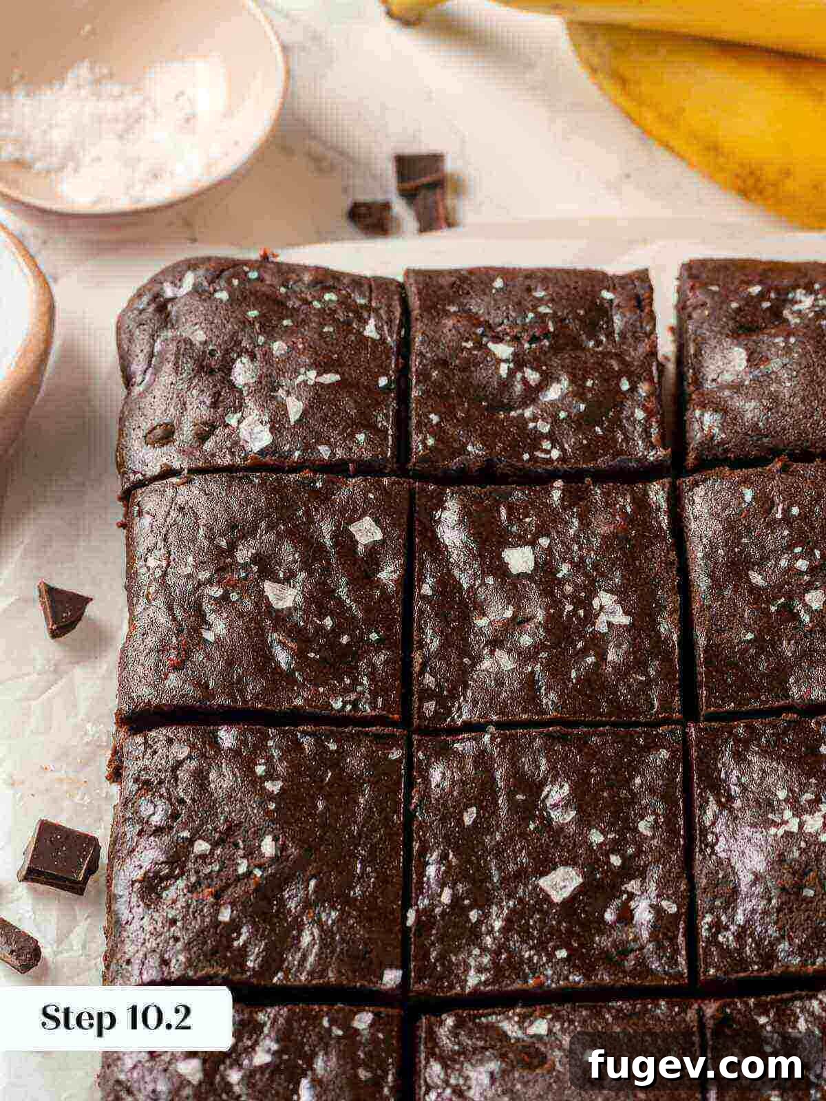 Fudgy Banana Brownies 12 Perfectly sliced banana brownies, showcasing their rich chocolate interior and ready to be served.