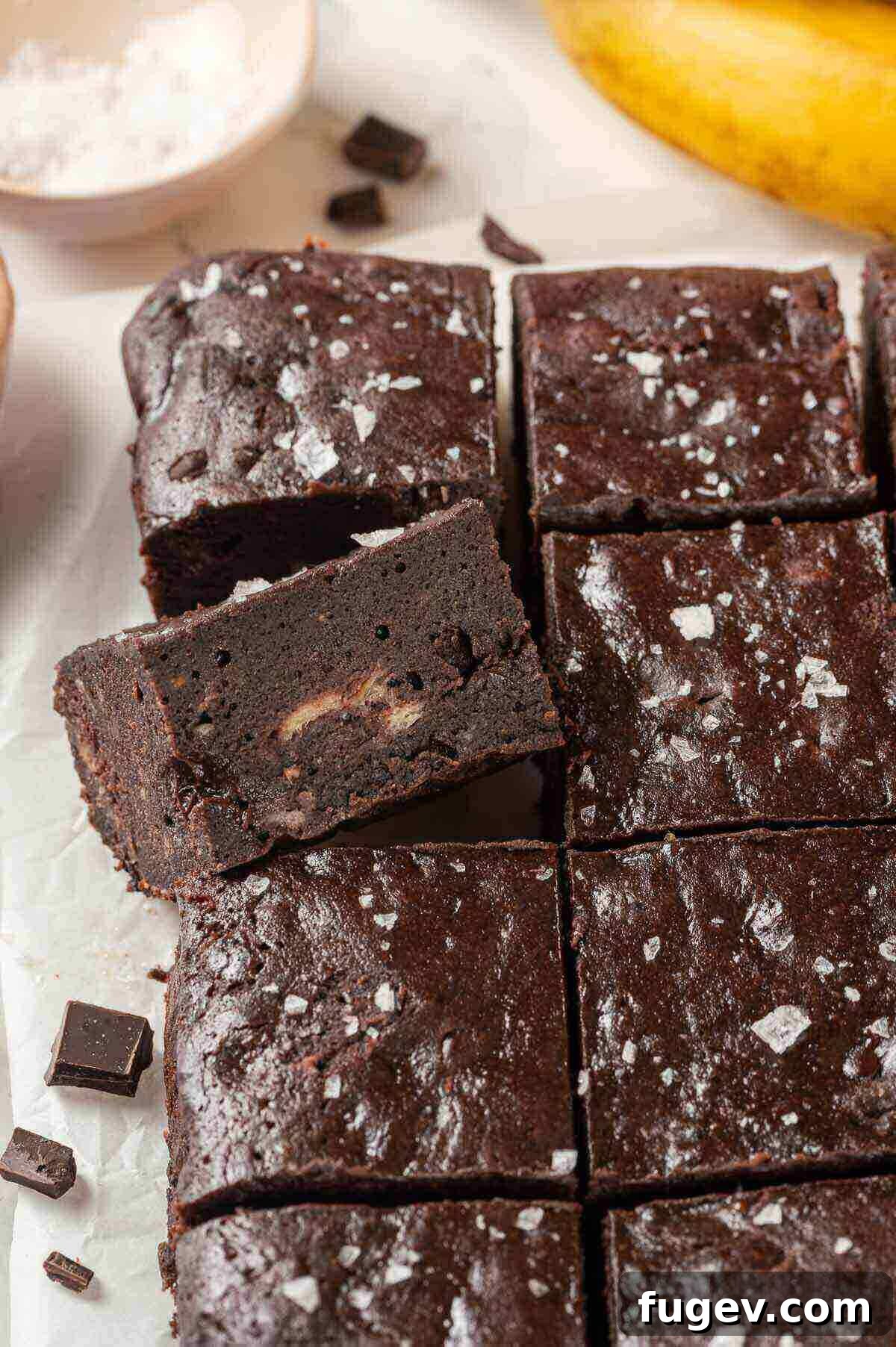 Fudgy Banana Brownies 13 Close-up of a stack of banana brownies, showing the melty chocolate chunks and fudgy texture.