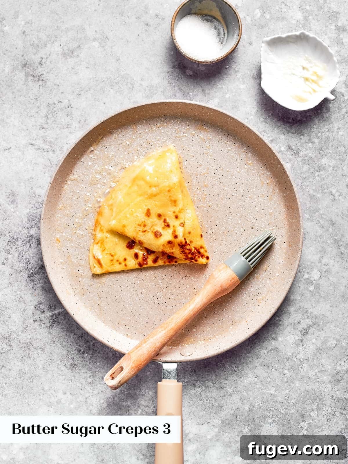Easy Sweet Crepe Perfection 12 Golden crepe folded again to create a classic triangle shape, perfect for a simple butter and sugar filling.