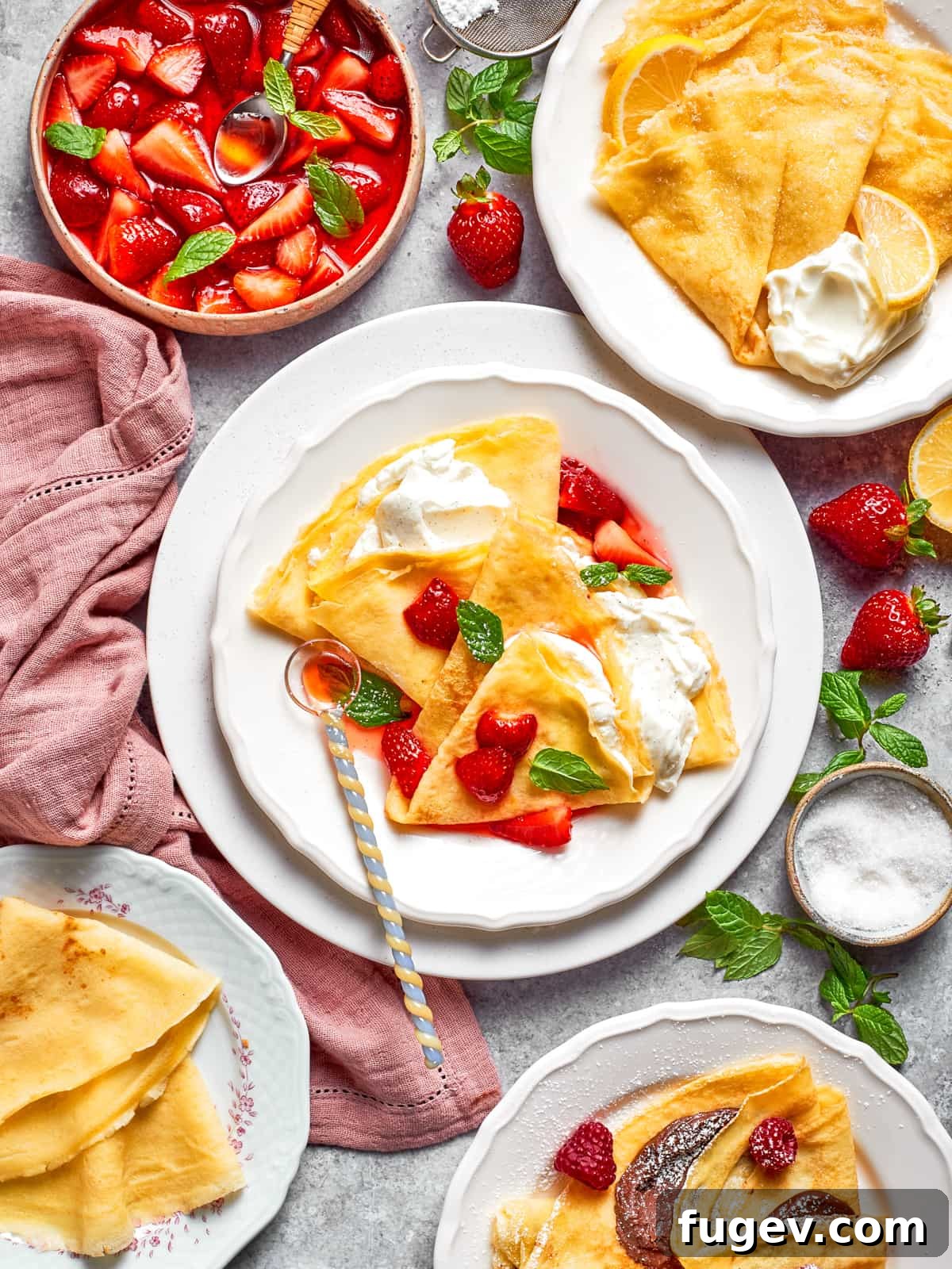 Easy Sweet Crepe Perfection 13 A beautifully plated Nutella crepe garnished with fresh strawberries and a dusting of powdered sugar, ready to be served.