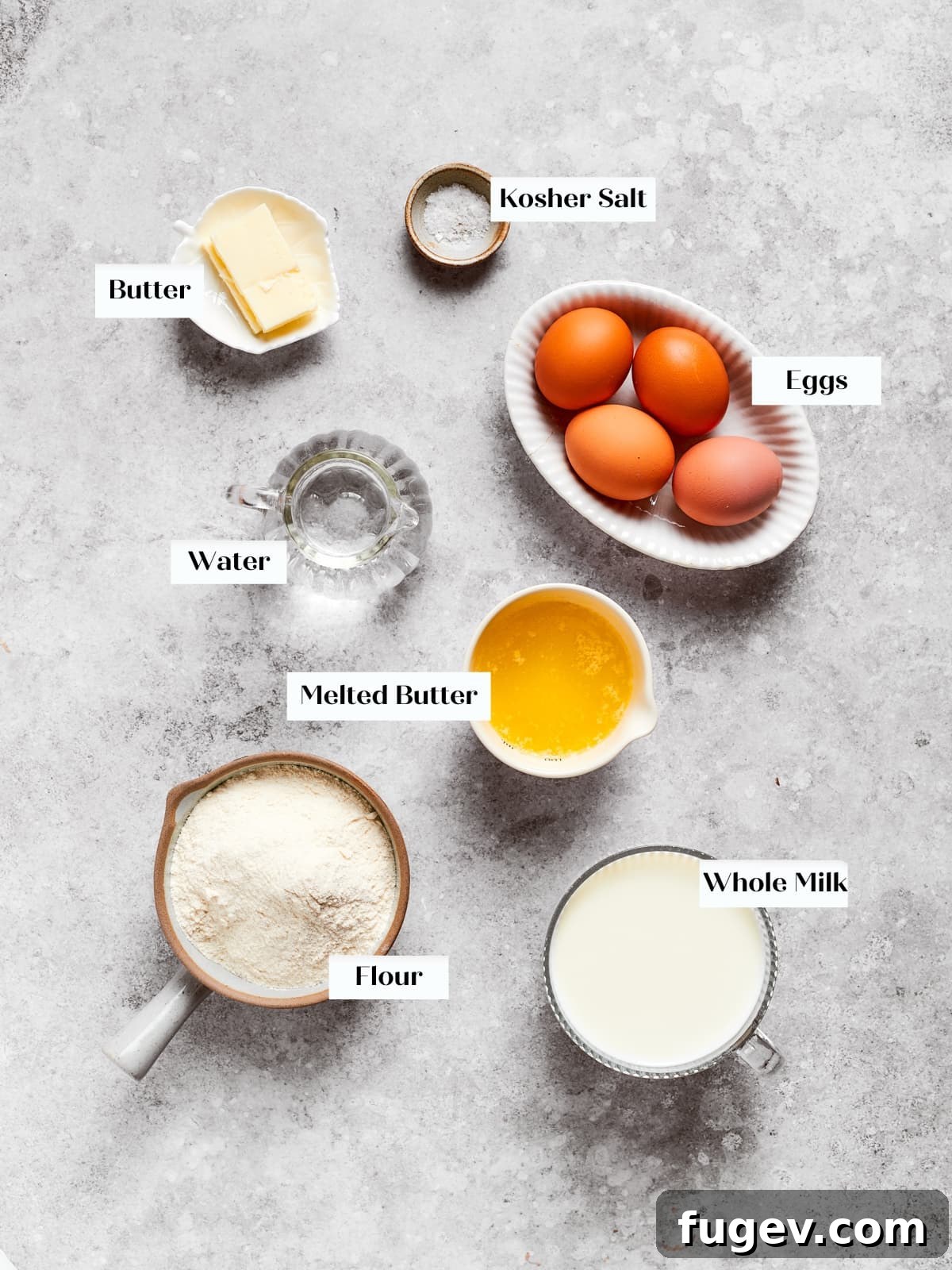 Easy Sweet Crepe Perfection 4 Eggs, flour, milk, and butter meticulously arranged on a countertop, ready for mixing into the perfect crepe batter.