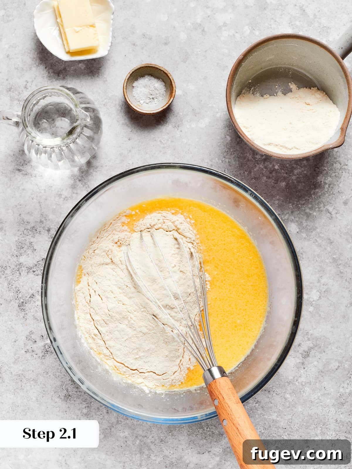 Easy Sweet Crepe Perfection 6 Flours being whisked slowly and gradually into the wet mixture to form a smooth crepe batter.