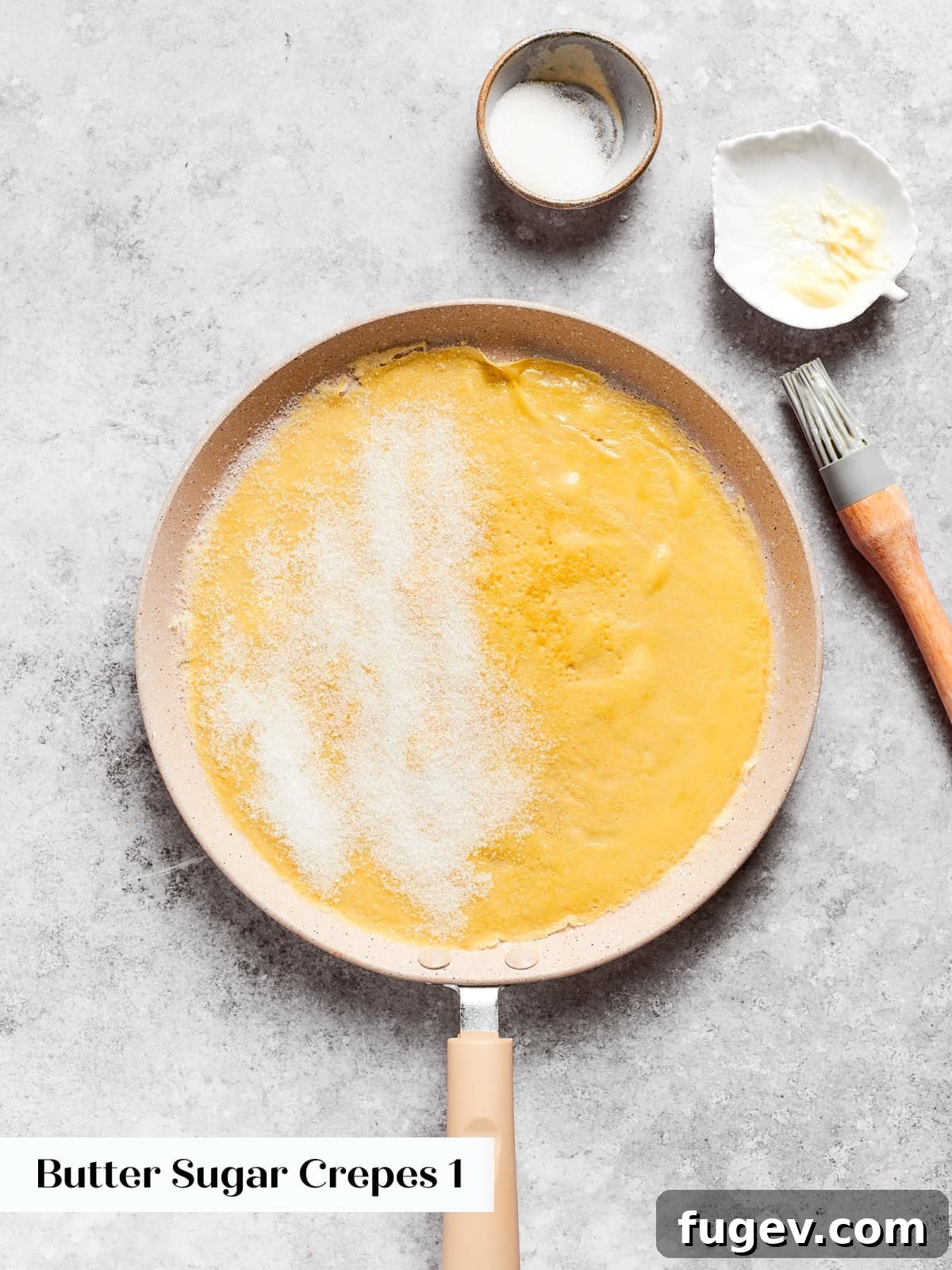 Easy Sweet Crepe Perfection 10 A warm crepe sprinkled on one side with granulated sugar before folding in the pan, creating a sweet coating.