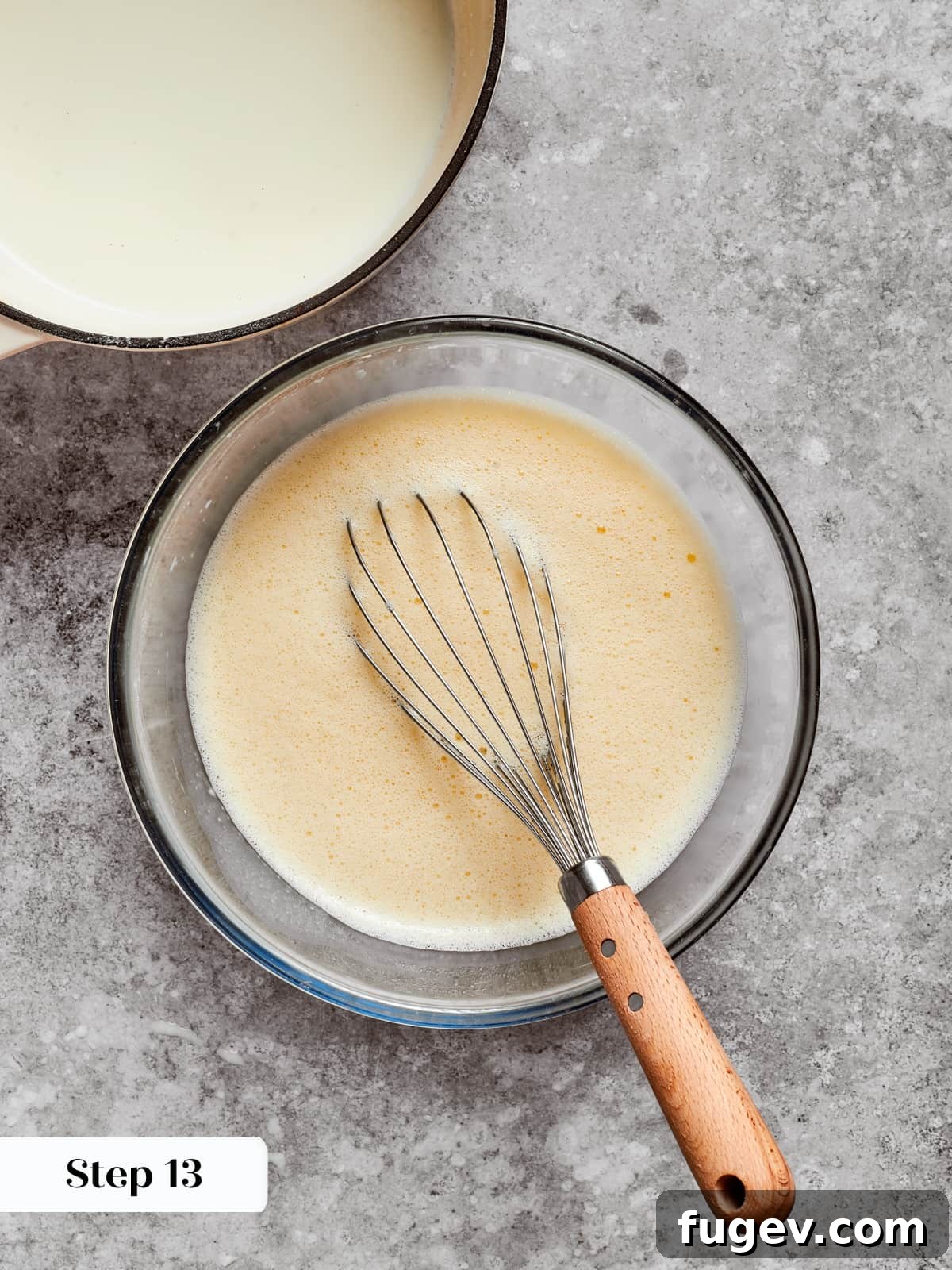 Silken Layered Crepe Delight 12 Slowly adding warm milk to eggs to prevent curdling during the pastry cream process.