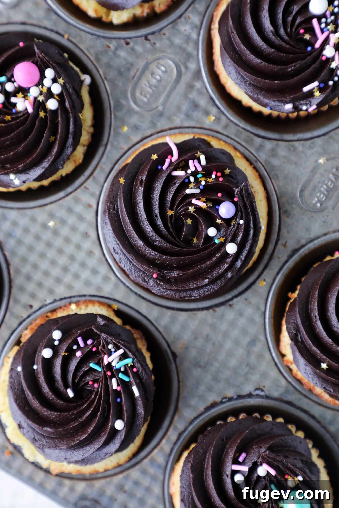 Sunny Yellow Cupcakes with Velvety Chocolate Frosting 4 Yellow Cupcakes with Chocolate frosting in vintage baking tin