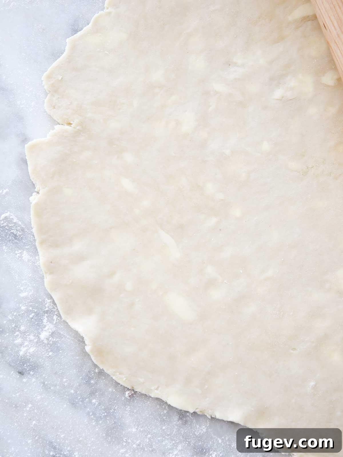 Rich Flaky Butter Pastry 2 Expertly rolled all-butter pie crust, thin and showing visible butter flecks.