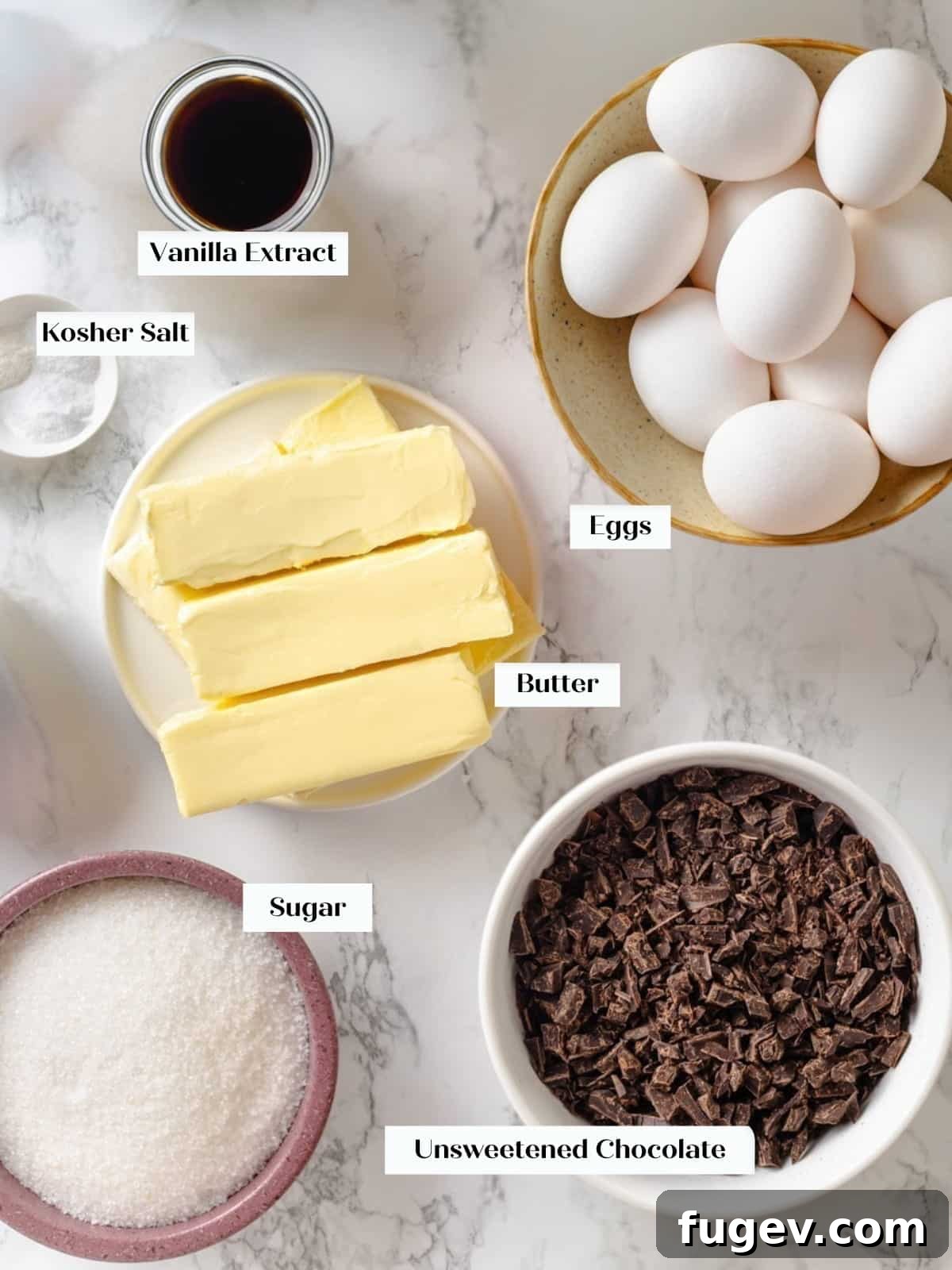 Silky Chocolate Swiss Meringue Buttercream 3 All the high-quality ingredients laid out for making chocolate buttercream, showcasing fresh egg whites, sugar, butter, salt, vanilla, and unsweetened chocolate.