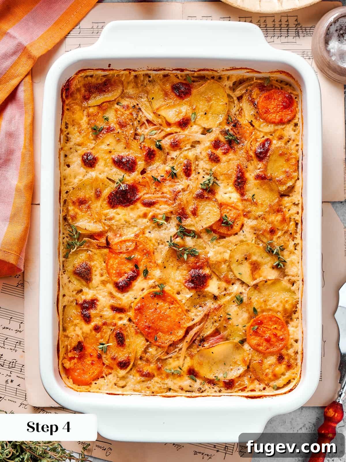 Effortless Scalloped Potato Perfection 12 Scalloped potatoes mid bake showing bubbling cheese sauce and lightly browned edges.