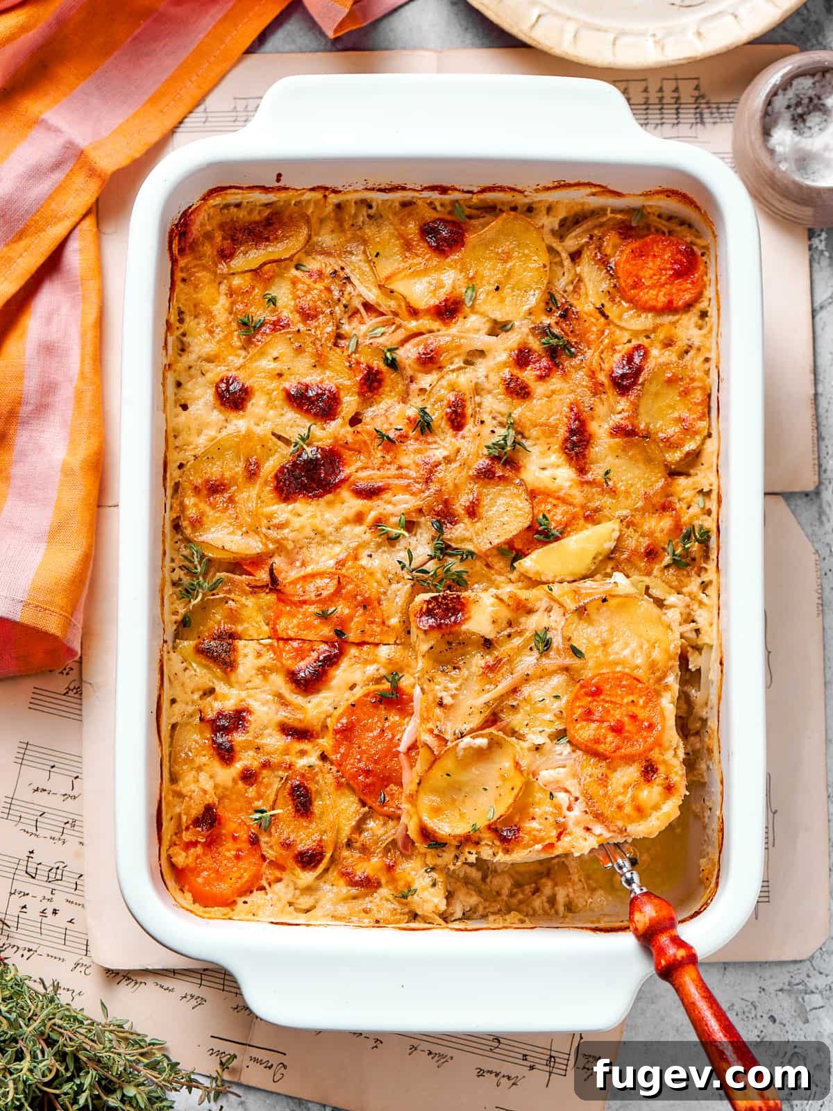 Effortless Scalloped Potato Perfection 14 Single slice of scalloped potatoes lifted from the dish showing layered texture.