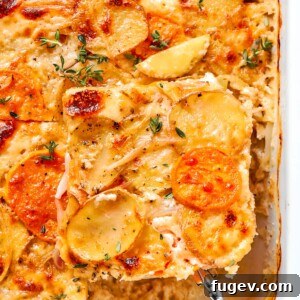 Neatly cut square of scalloped potatoes being served from baking dish.