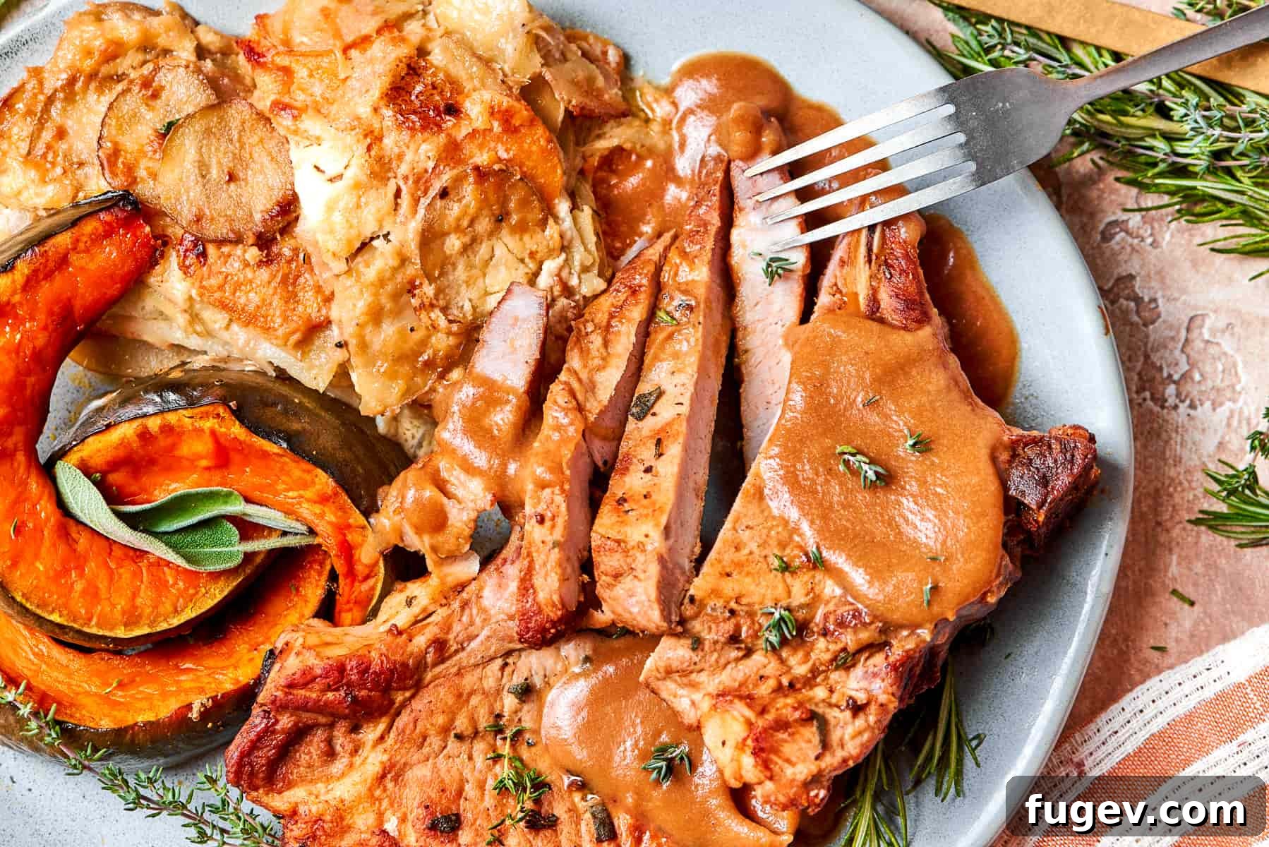 Succulent Pork with Warm Apple Compote 5 Perfectly pan-seared pork chop artfully paired with a generous serving of warm, luscious applesauce sauce, ready for a delightful dinner.