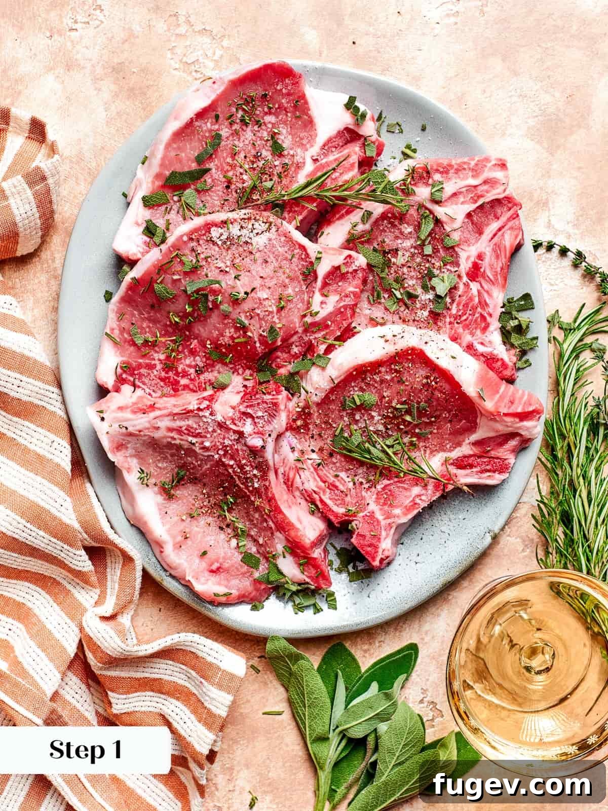 Succulent Pork with Warm Apple Compote 6 Raw pork chops meticulously seasoned with kosher salt, freshly ground black pepper, and finely chopped fresh herbs, ready for searing.