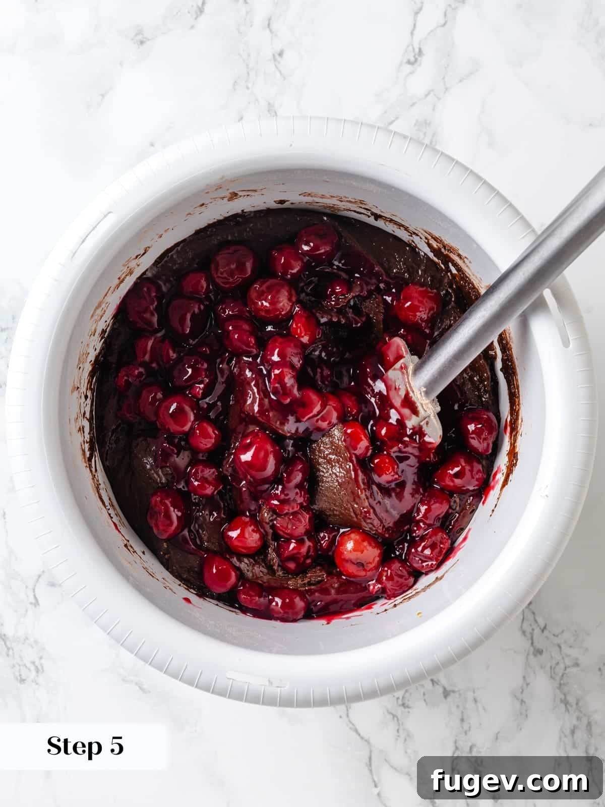 Velvet Chocolate Cherry Indulgence 13 Cherry pie filling gently stirred through the cake batter to evenly distribute the fruit without breaking it down too much.