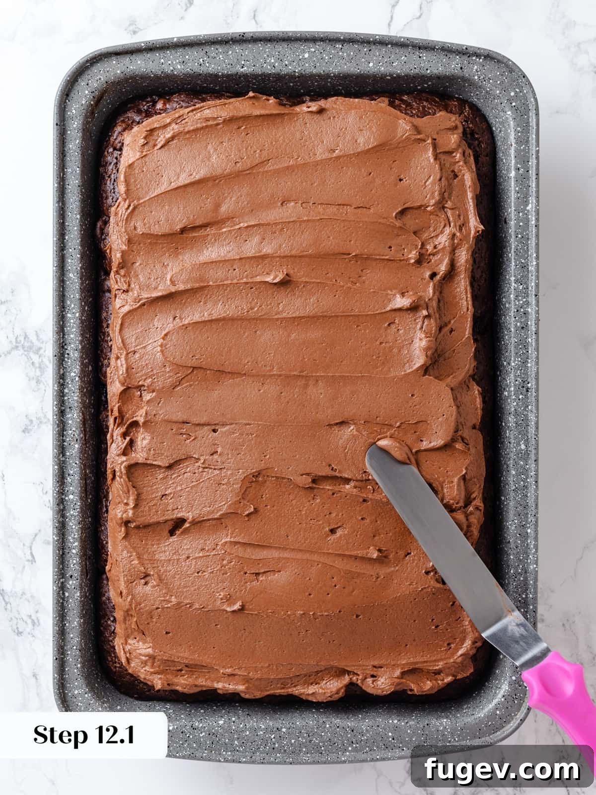Velvet Chocolate Cherry Indulgence 18 Chocolate cream cheese frosting evenly layered over the cooled chocolate cake before decorative swirling.