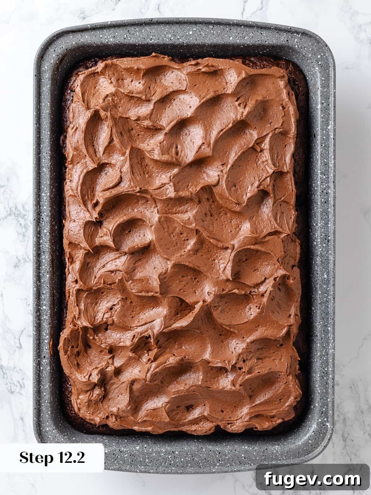 Velvet Chocolate Cherry Indulgence 19 Chocolate cream cheese frosting expertly swirled decoratively across the baked cake using an offset spatula.