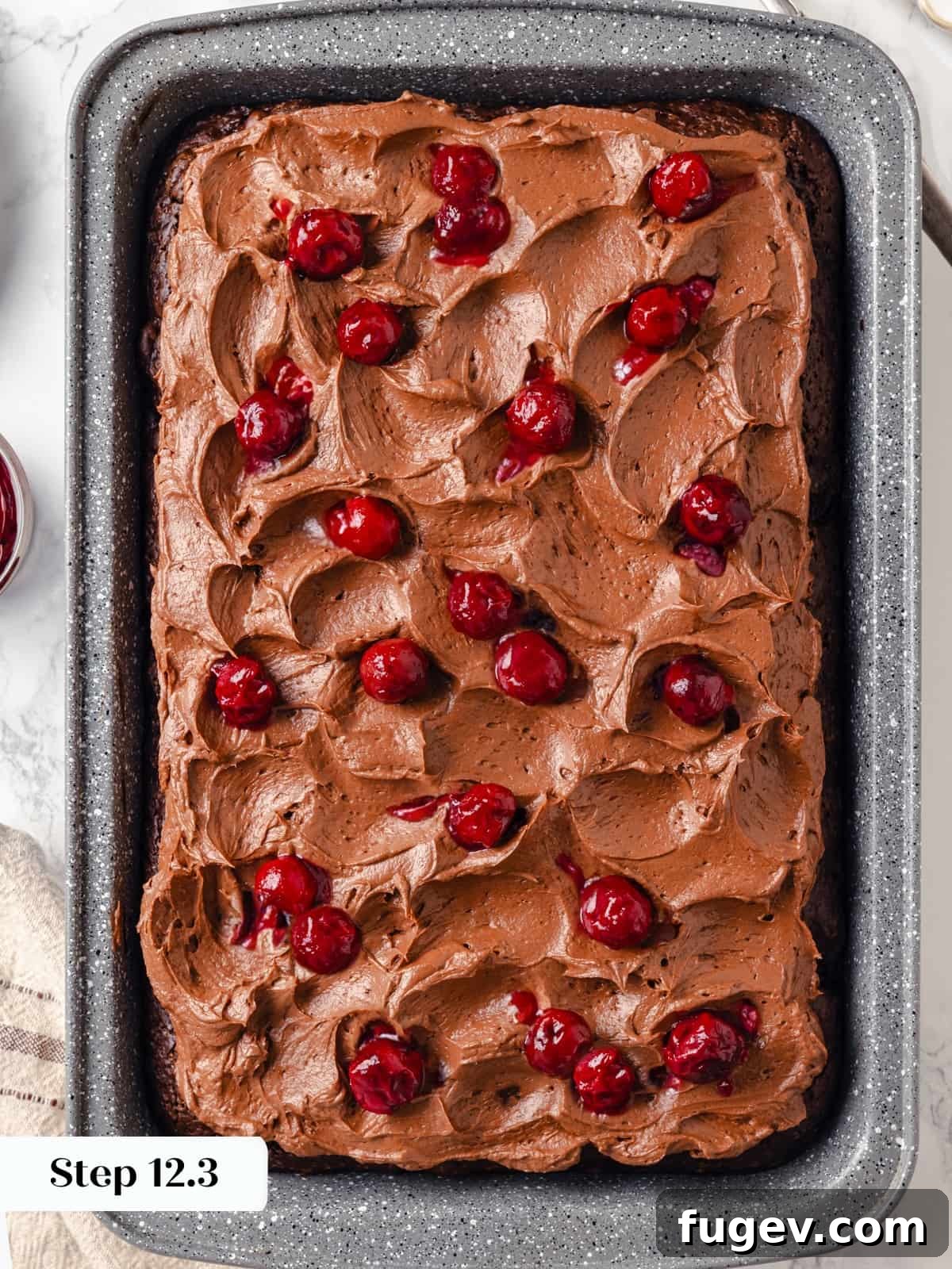Velvet Chocolate Cherry Indulgence 20 Fresh cherries gently spread over the chocolate cream cheese frosting on the finished cake as a delightful garnish.