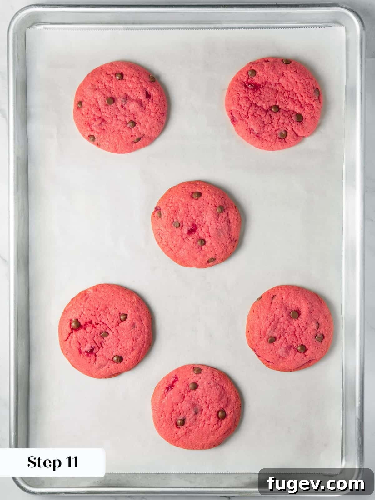 Luscious Cherry Chocolate Chip Cookies 16 Cherry chocolate chip cookies freshly baked, displaying soft centers and vibrant red color.