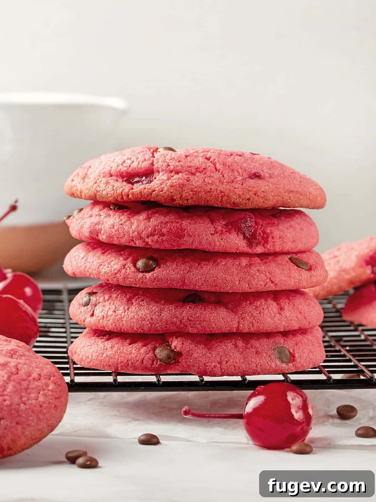 Luscious Cherry Chocolate Chip Cookies 17 A beautiful stack of bright red cherry chocolate chip cookies, showcasing their thick and chewy texture.