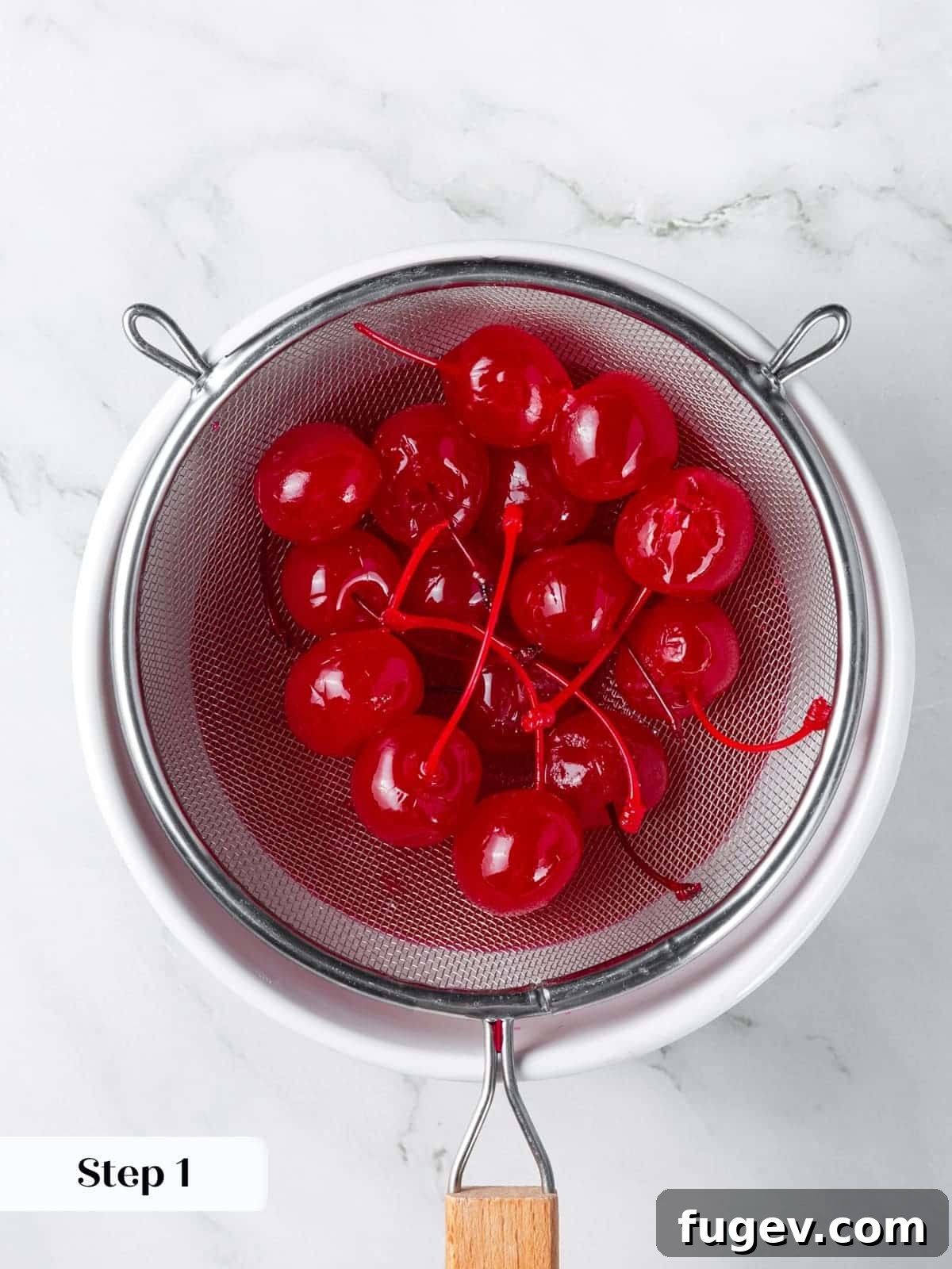 Luscious Cherry Chocolate Chip Cookies 6 Maraschino cherries actively draining in a sieve to remove excess liquid.