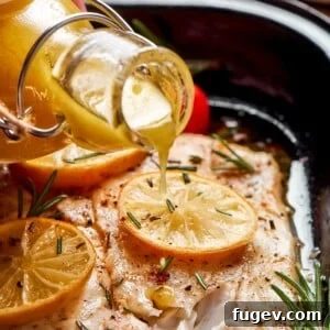 Sparkling Champagne Vinaigrette 11 Champagne vinaigrette flowing from a bottle onto cooked fish for simple seasoning.