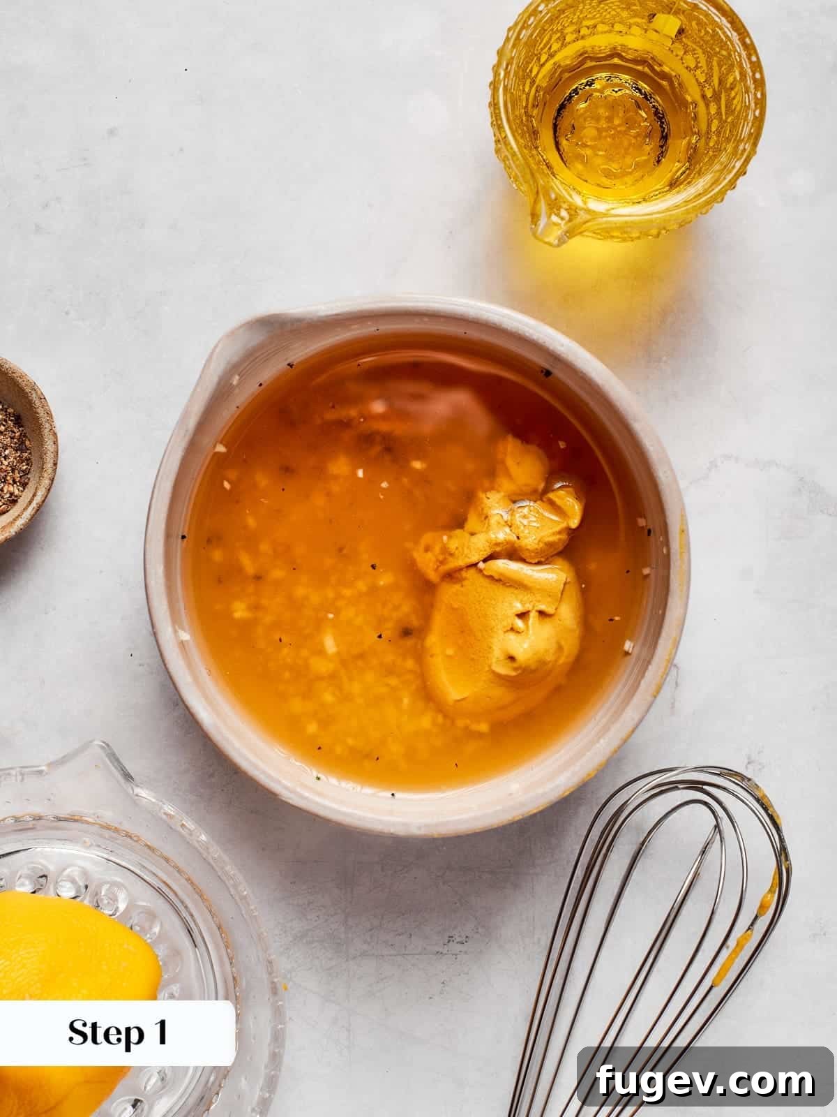 Sparkling Champagne Vinaigrette 6 Base ingredients being mixed to start champagne vinaigrette dressing in a bowl.