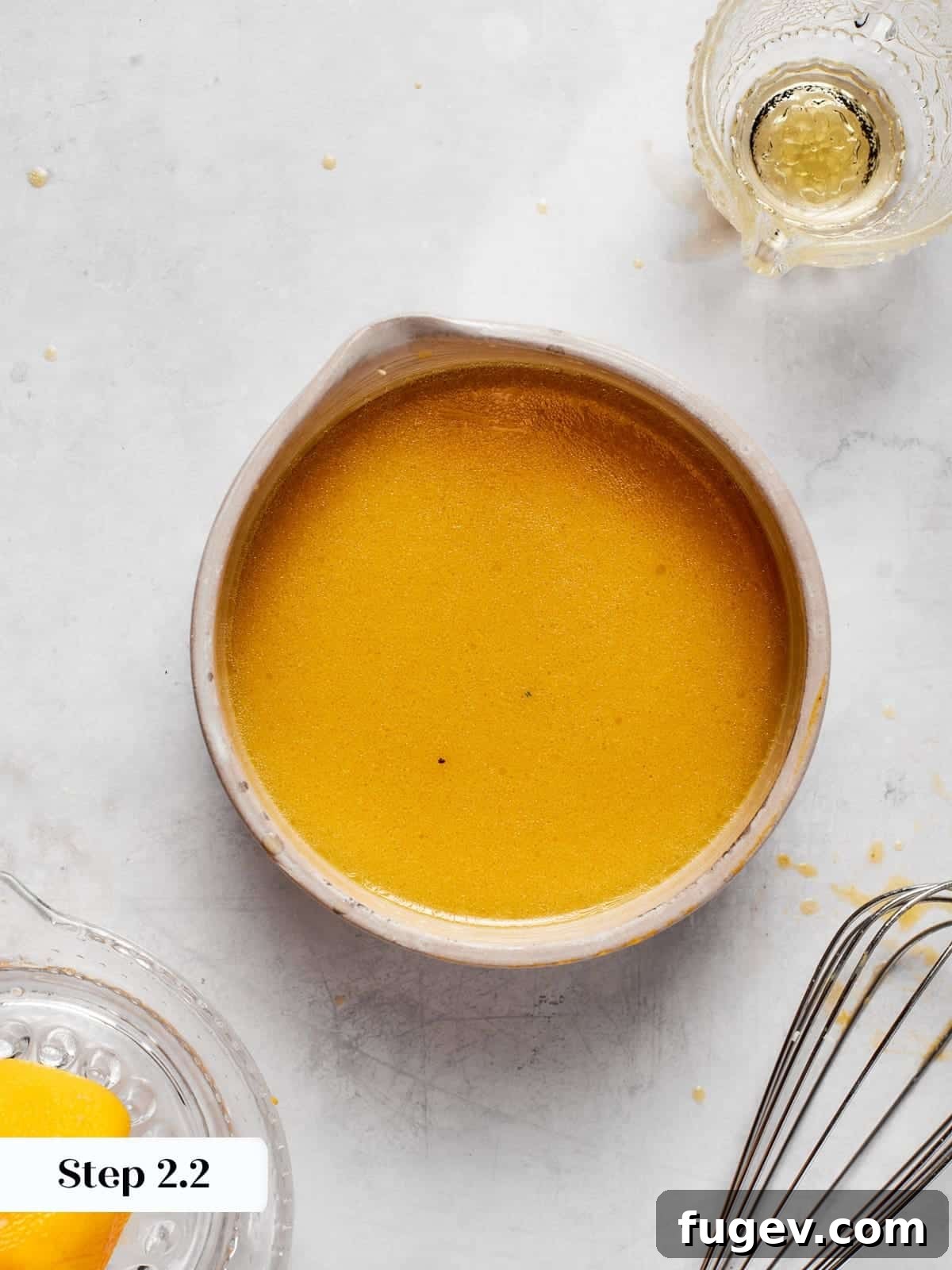 Sparkling Champagne Vinaigrette 8 Smooth emulsified champagne vinaigrette showing a unified and creamy texture after whisking.