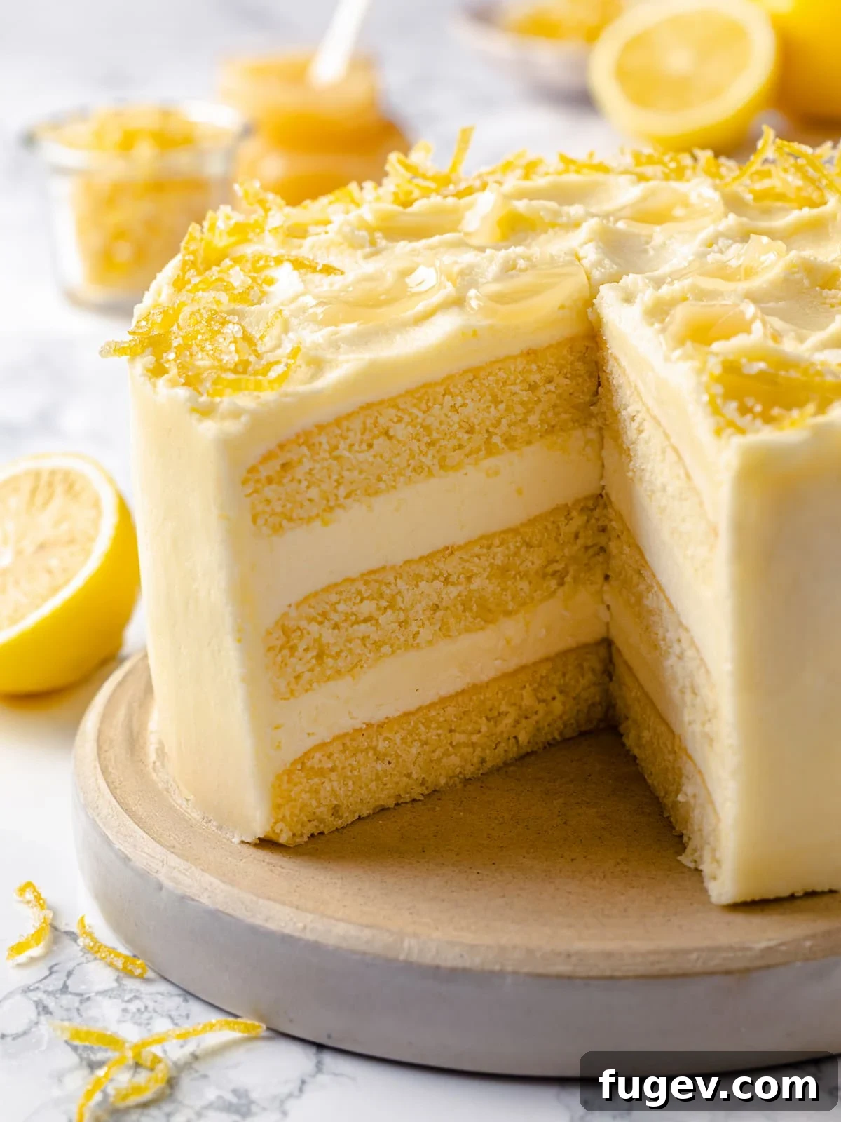 A perfectly sliced lemon cake showcasing structured layers, smooth frosting, and a wonderfully moist crumb, inviting a delicious bite.