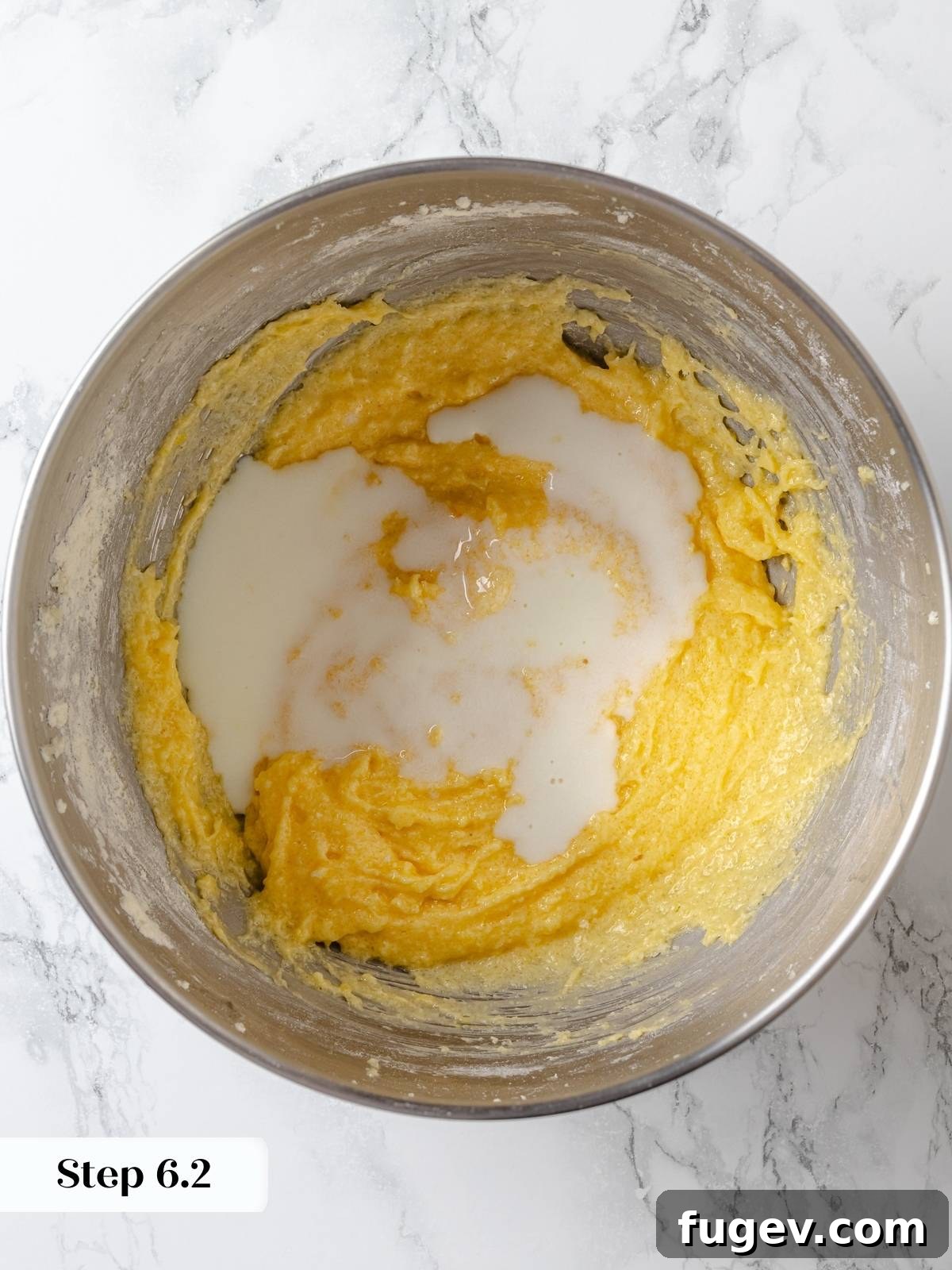 Buttermilk and fresh lemon juice are added to the cake batter during the mixing stage, providing moisture and a bright tang.