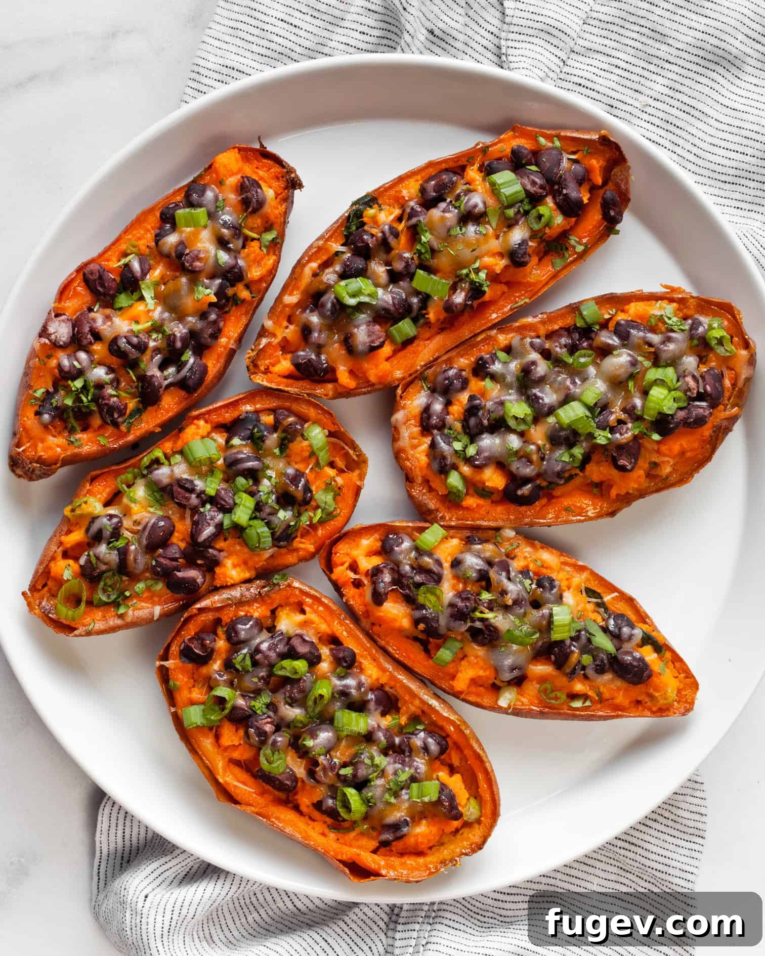 Sweet Potato Boats 2 Platter of loaded sweet potato skins garnished with cilantro and scallions
