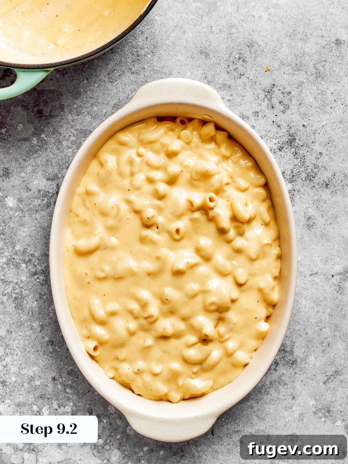 Golden Crusted Baked Mac and Cheese 15 Perfectly coated elbow macaroni noodles nestled in a baking dish, generously covered in creamy cheese sauce, ready for the oven.