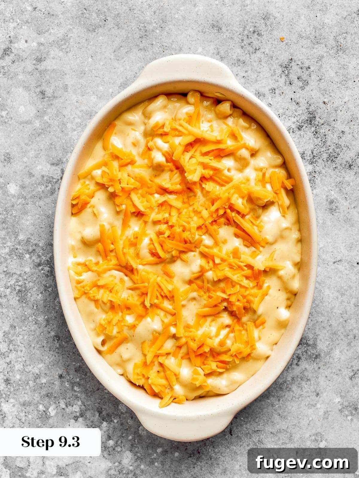 Golden Crusted Baked Mac and Cheese 16 The mac and cheese beautifully assembled in its baking dish, topped with reserved cheese, eagerly awaiting its transformation in the oven.