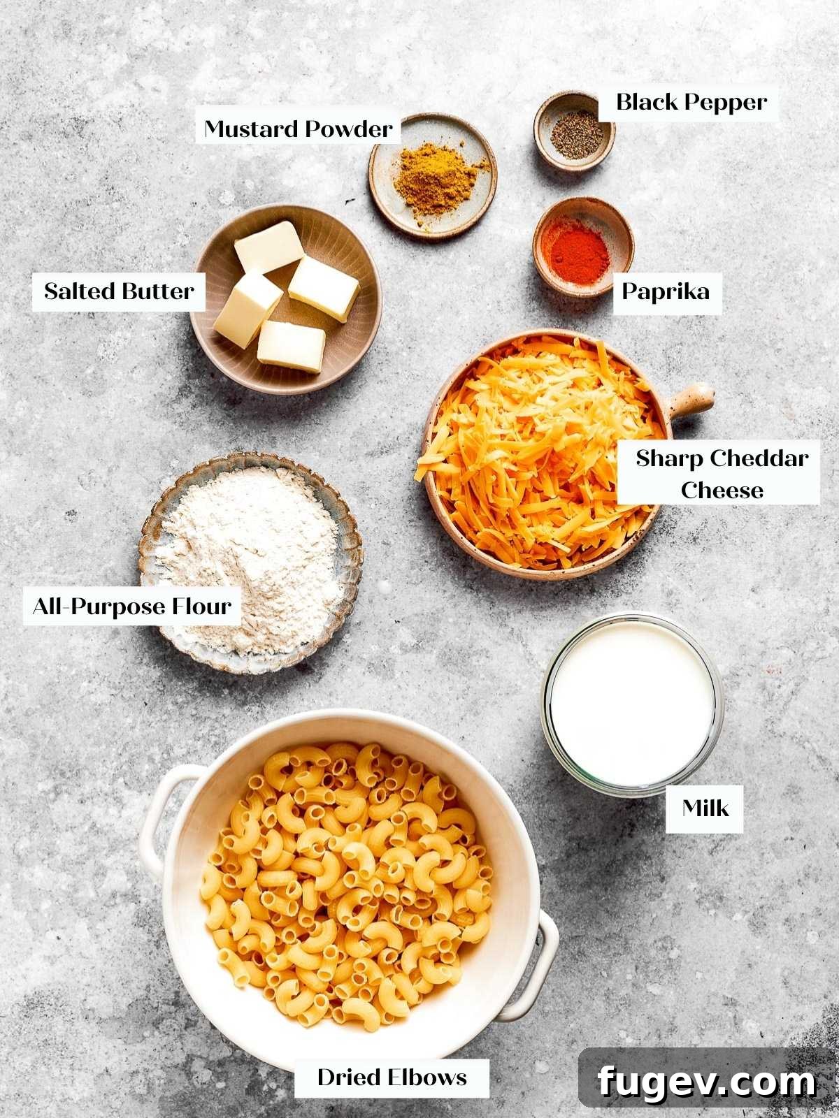 Golden Crusted Baked Mac and Cheese 4 A beautiful display of all the fresh, high-quality ingredients needed for this baked mac and cheese recipe, laid out on a clean countertop.