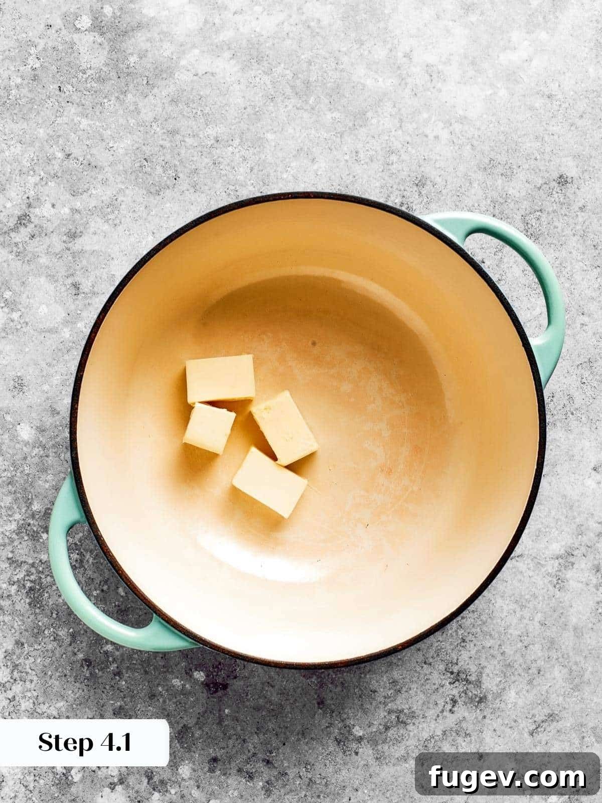 Golden Crusted Baked Mac and Cheese 6 Butter gently melting in a saucepan, forming the foundation of the creamy cheese sauce.