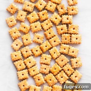 Savory Baked Cheese Crisps 6 Homemade Cheese Crackers on a baking sheet, golden and crisp