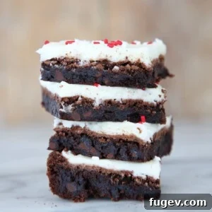 A delightful stack of Peppermint Triple Chocolate Brownies, an inviting festive dessert.