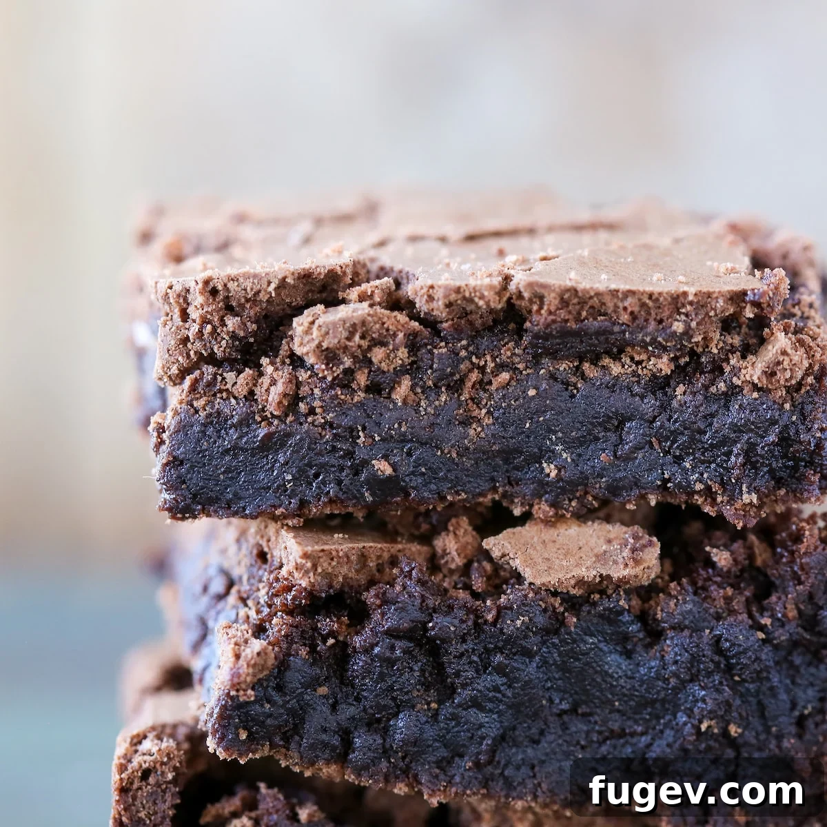 16 Festive Chocolate Christmas Cookies 18 A stack of rich Browned Butter Brownies with intricate detailed texture, highlighting their fudgy, gourmet quality.