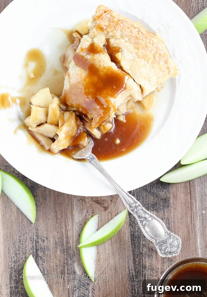 Creamy Butterscotch Apple Tart 4 The golden-brown Apple Butterscotch Pie, fresh from the oven, cooling on a wooden surface.
