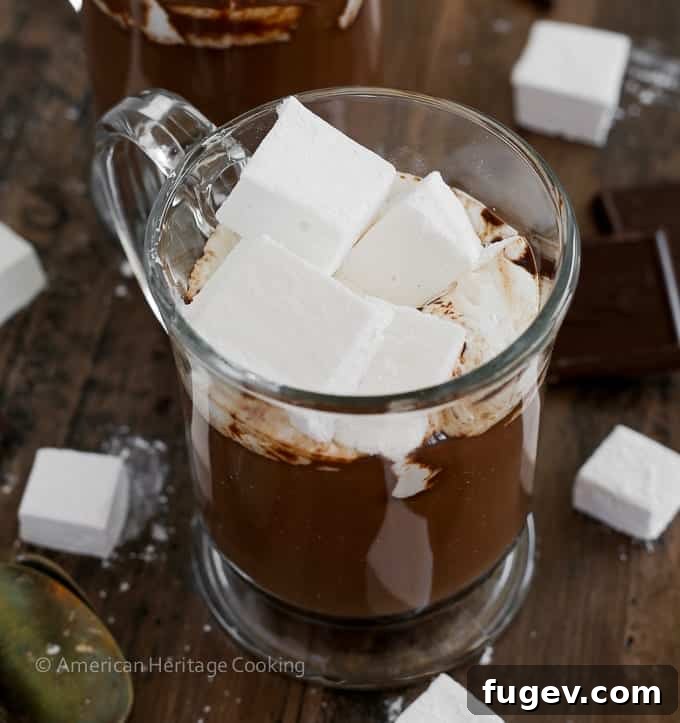 A Sip of Hot Chocolate Heaven 6 Two mugs of the best hot chocolate, generously topped with homemade marshmallows, ready to be enjoyed.
