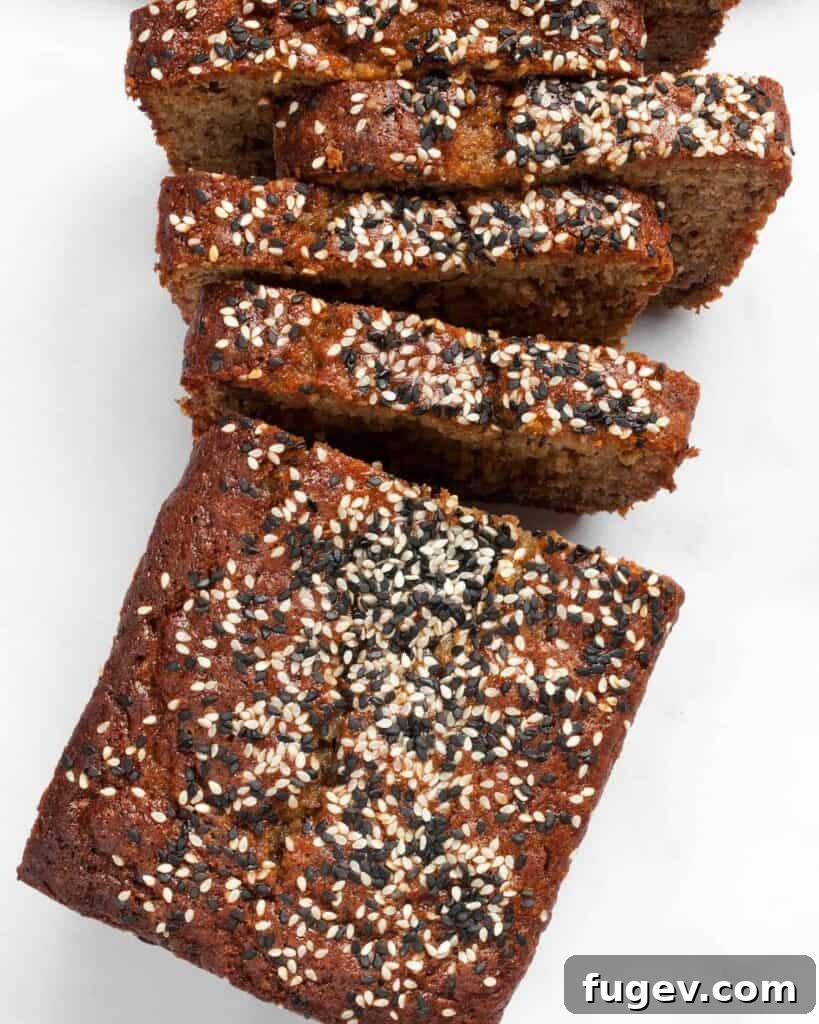 Tahini Swirled Banana Bread 2 Delicious Chocolate Tahini Banana Bread loaf sliced with sesame seeds on top