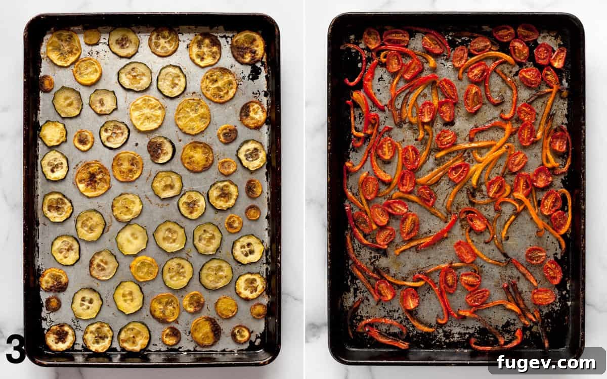 Roasted Garden Vegetable Naan Flatbread 5 Roasted sliced zucchini and yellow squash on one baking sheet, and roasted sliced bell peppers and halved grape tomatoes on another, showcasing their golden, caramelized edges.