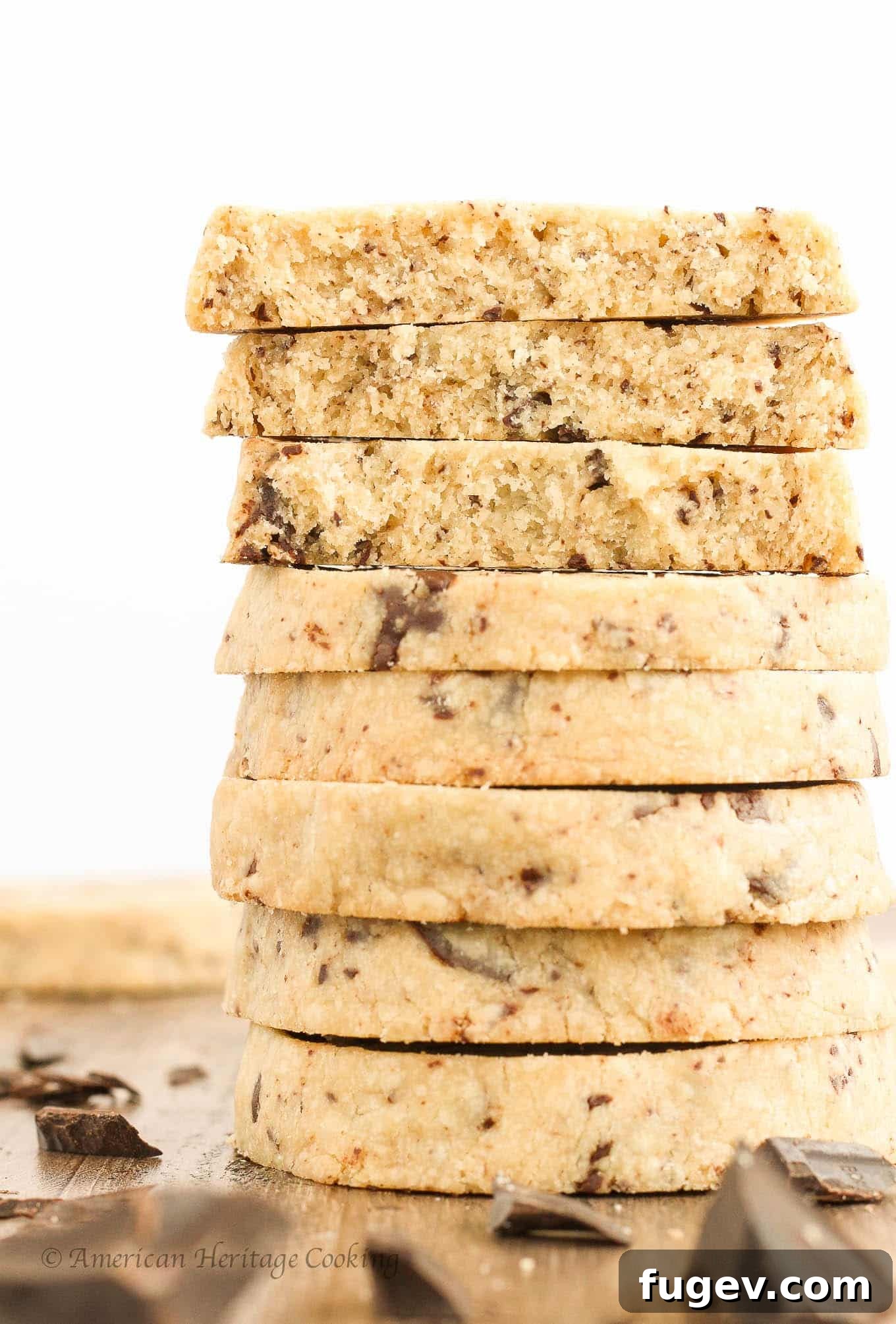Buttery Chocolate Chip Shortbread Delights 4 A stack of chocolate chip shortbread cookies on a plate, ready to be enjoyed.