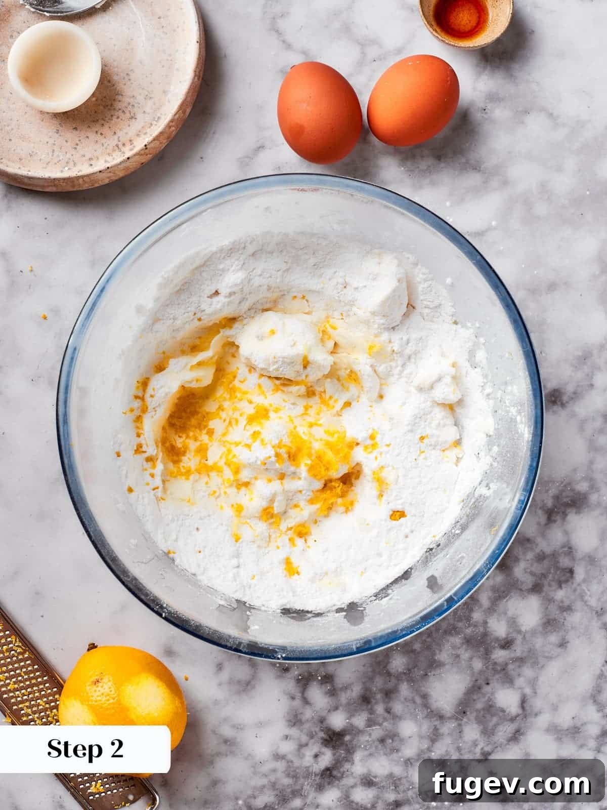 Easy Spritz Cookie Perfection 6 sugar, lemon, and flour combined in a mixing bowl to form smooth spritz cookie dough.